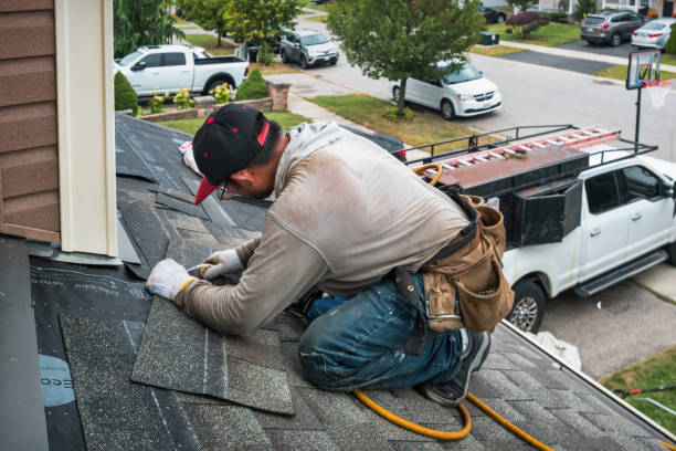 Professional Roofing technician working in Taftville, CT